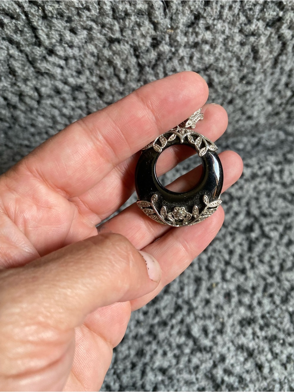 Black Circular Pendant Necklace with Silver Floral Accents